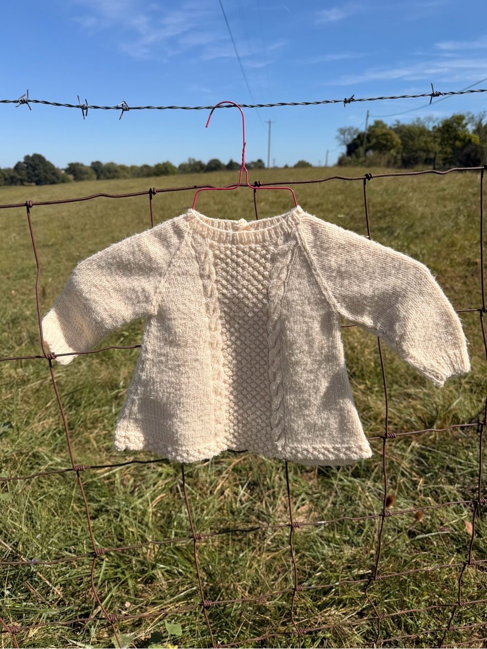 Hand Crafted Aran Cable Knit Baby Sweater featuring a beautiful trinity stitch